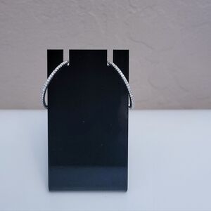 Moissanite hoop earring on sterling silver